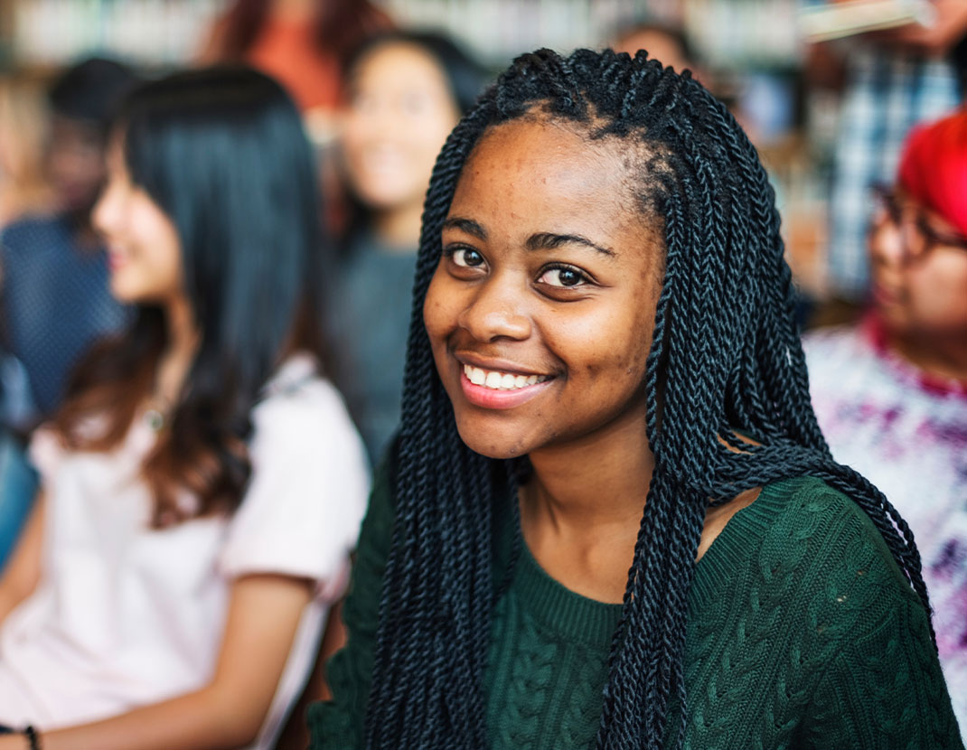 teen black girl smiling at camera